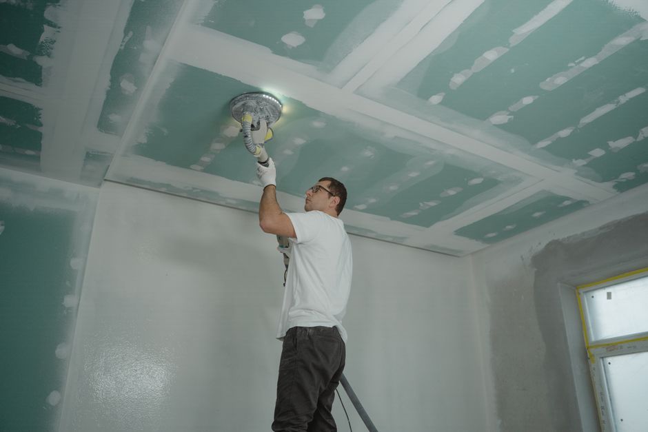 Drywall being installed and finished